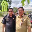 Ketua DPRD Gumas Akerman Sahidar tampak akrap dengan Staf Ahli Bupati Guanhin.