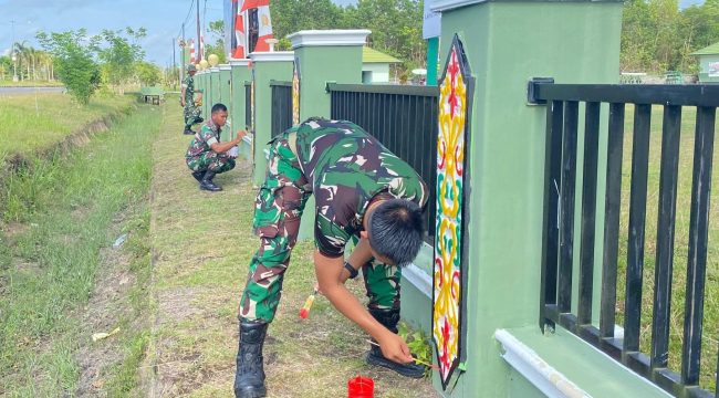 FOTO : Prajurit tampak antusias bergotong royong memperbaiki sarana prasarana lingkungan sekitar markas.
